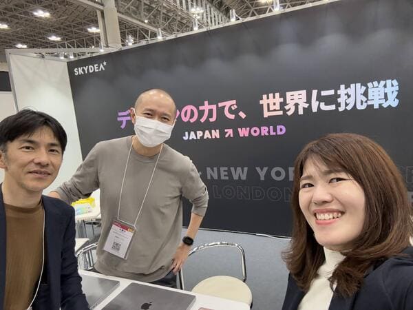 SKYDEA team selfie at the Content Tokyo exhibition booth